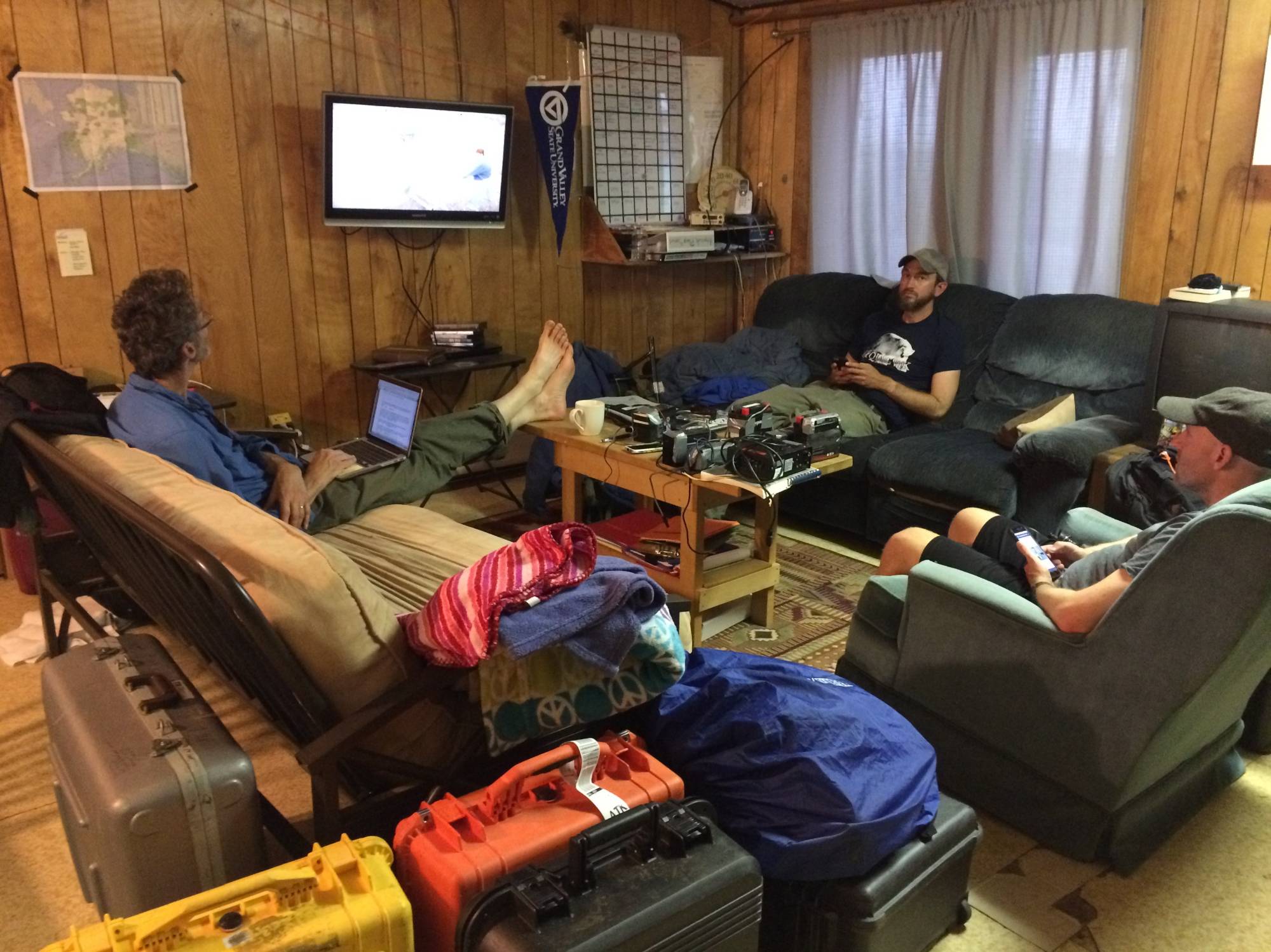 Members sit in the living room.
